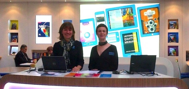 Alison Thomson and Gemma Valpy standing at the Cambridge University Press stand at Frankfurt Book Fair 2013.
