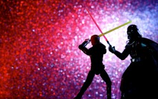 Luke Skywalker figure battling Darth Vader figure
