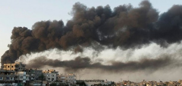 Smoke from buildings damaged in Gaza Strip, 2008. Photo: Amir Farshad Ebrahimi via Creative Commons.
