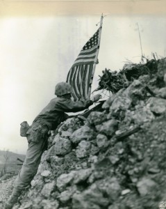 US Marines raising the flag atop the ruins of Shuri Castle after the Battle of Okinawa. Image courtesy of Wikimedia Commons