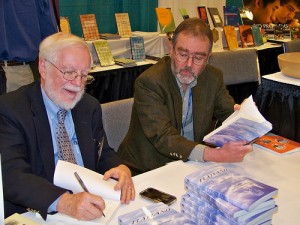 Banchoff and Lindgren sign copies of "Flatland" at MAA