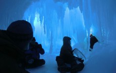 Students in an ice cave on the Erbus Ice Tongue