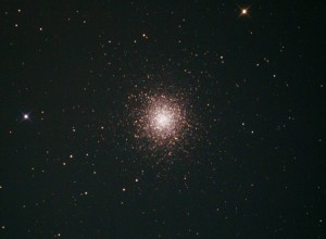 M13 as it looks through a mid-sized scope. The cluster is actually quite large in the sky, about half the size of the full moon, but only the bright center is visible to the unaided eye, and dark skies are needed for that.