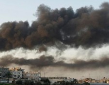 Smoke from buildings damaged in Gaza Strip, 2008. Photo: Amir Farshad Ebrahimi via Creative Commons.