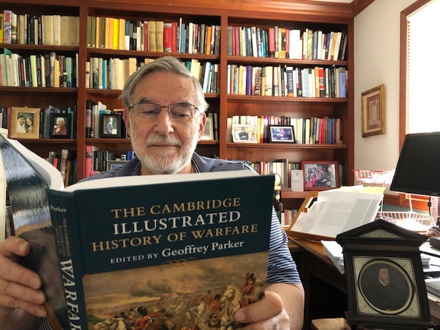Editor Geoffrey Parker is pictured reading The Cambridge Illustrated History of Warfare
