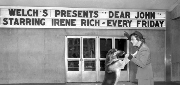 LOS ANGELES - MAY 1: CBS Radio actress Irene Rich at CBS KNX radio studios at Columbia Square, Hollywood, CA. She portrays the character Faith Chandler in Dear John, one of the Irene Rich Dramas on CBS Radio. She is with a German Shepherd dog. May 1, 1942. (Photo by CBS via Getty Images)